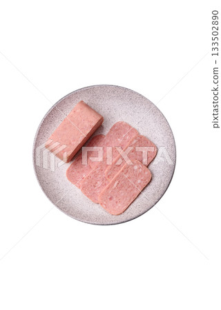 Spiced ham slices, canned meat for lunch sandwiches. Spiced ham as a food background Spiced ham slices, canned meat for lunch sandwiches. Spiced ham as a food background 133502890