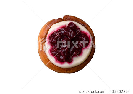 Cinnamon roll, a sweet bun with citrus, cherries, and chocolate, a Danish dessert with cream Cinnamon roll, a sweet bun with citrus, cherries, and chocolate, a Danish dessert with cream 133502894