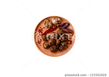 Grilled mushroom pieces, a vegetarian healthy meal with sauce. Barbecue mushroom halves 133502928