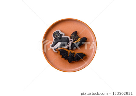 Halloween cookies, sweets, or gingerbread, a cat, a bat, and a hat. Halloween gingerbread Halloween cookies, sweets, or gingerbread, a cat, a bat, and a hat. Halloween gingerbread 133502931
