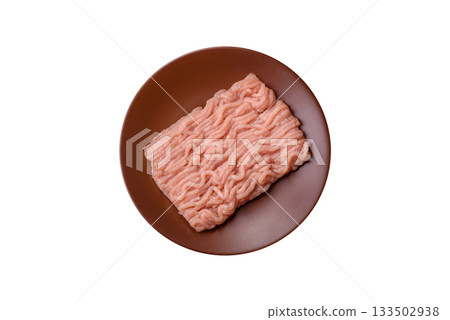 Raw minced chicken for a burger or as an ingredient in a meat dish. Raw ground chicken 133502938