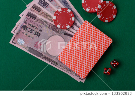 Casino game in the Japan, yen money, chips, cards. Gambling in casinos in the Japan Casino game in the Japan, yen money, chips, cards. Gambling in casinos in the Japan 133502953