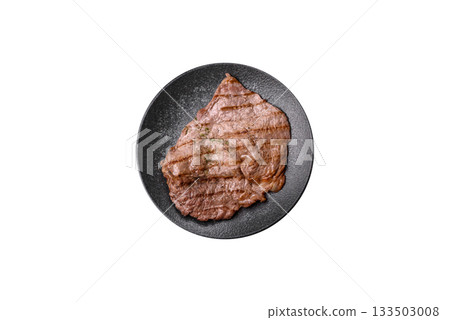 Grilled beef steak, meat cooked on barbecue with salt and pepper. Grilled beef steak Grilled beef steak, meat cooked on barbecue with salt and pepper. Grilled beef steak 133503008
