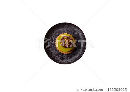 Pistachio cake or tart topped with green mousse with nuts and fruit filling. Pistachio pie Pistachio cake or tart topped with green mousse with nuts and fruit filling. Pistachio pie 133503015