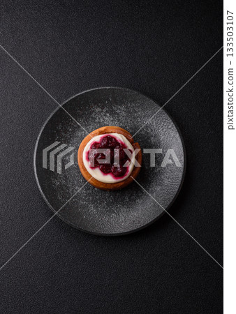 Cinnamon roll, a sweet bun with citrus, cherries, and chocolate, a Danish dessert with cream Cinnamon roll, a sweet bun with citrus, cherries, and chocolate, a Danish dessert with cream 133503107