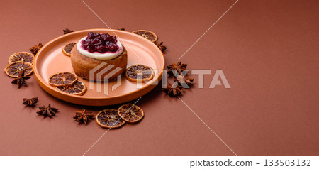Cinnamon roll, a sweet bun with citrus, cherries, and chocolate, a Danish dessert with cream 133503132