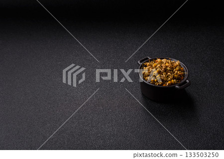 Dried chamomile flowers, herbal tea in a bowl for a hot morning drink. Dried chamomile 133503250