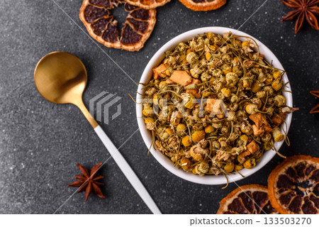 Dried chamomile flowers, herbal tea in a bowl for a hot morning drink. Dried chamomile 133503270