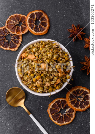Dried chamomile flowers, herbal tea in a bowl for a hot morning drink. Dried chamomile 133503271