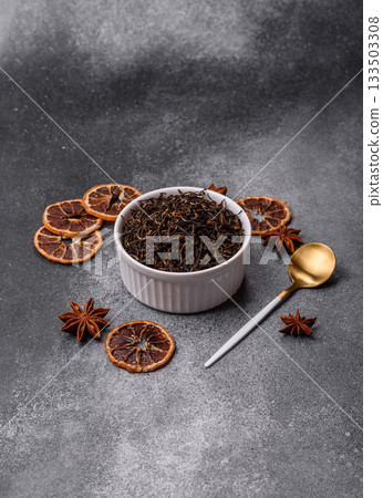 Golden black tea, dried leaves of a Chinese or Indian breakfast drink. Black tea dried leaves Golden black tea, dried leaves of a Chinese or Indian breakfast drink. Black tea dried leaves 133503308