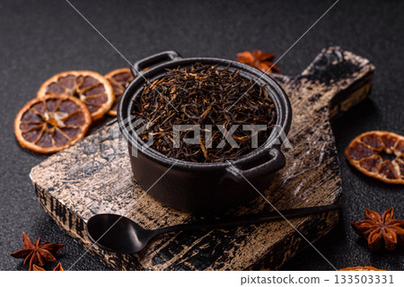 Golden black tea, dried leaves of a Chinese or Indian breakfast drink. Black tea dried leaves Golden black tea, dried leaves of a Chinese or Indian breakfast drink. Black tea dried leaves 133503331