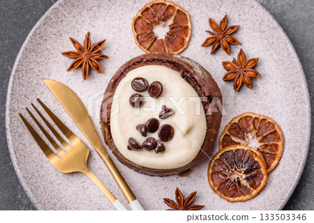Cinnamon roll, a sweet bun with citrus, cherries, and chocolate, a Danish dessert with cream 133503346
