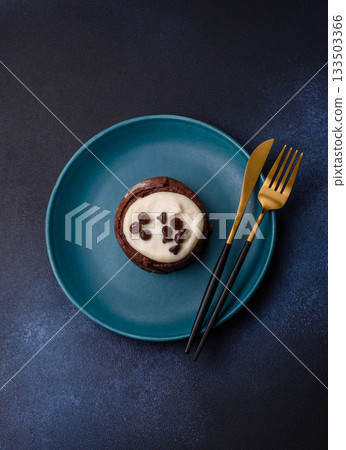 Cinnamon roll, a sweet bun with citrus, cherries, and chocolate, a Danish dessert with cream 133503366
