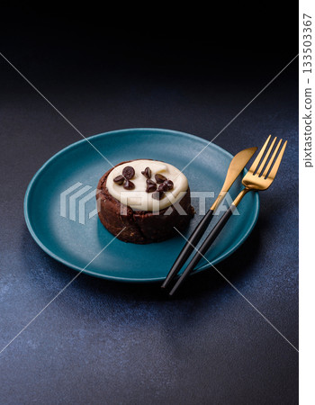 Cinnamon roll, a sweet bun with citrus, cherries, and chocolate, a Danish dessert with cream Cinnamon roll, a sweet bun with citrus, cherries, and chocolate, a Danish dessert with cream 133503367