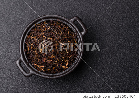 Golden black tea, dried leaves of a Chinese or Indian breakfast drink. Black tea dried leaves 133503404