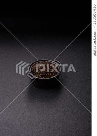 Golden black tea, dried leaves of a Chinese or Indian breakfast drink. Black tea dried leaves 133503410