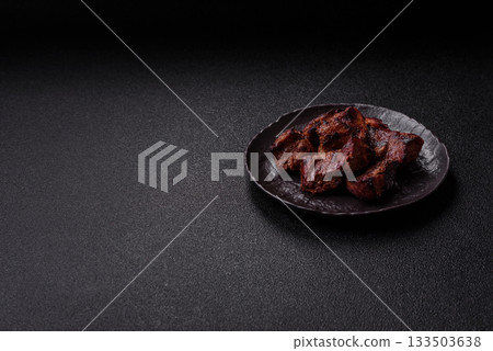 Beef, grilled meat in pieces, or kebab with sauce and vegetables. Beef in pieces Beef, grilled meat in pieces, or kebab with sauce and vegetables. Beef in pieces 133503638