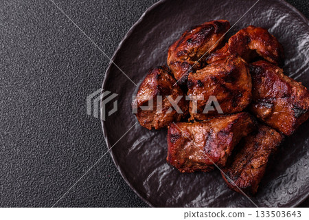 Beef, grilled meat in pieces, or kebab with sauce and vegetables. Beef in pieces Beef, grilled meat in pieces, or kebab with sauce and vegetables. Beef in pieces 133503643