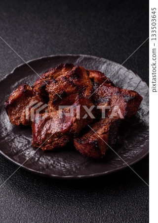 Beef, grilled meat in pieces, or kebab with sauce and vegetables. Beef in pieces Beef, grilled meat in pieces, or kebab with sauce and vegetables. Beef in pieces 133503645
