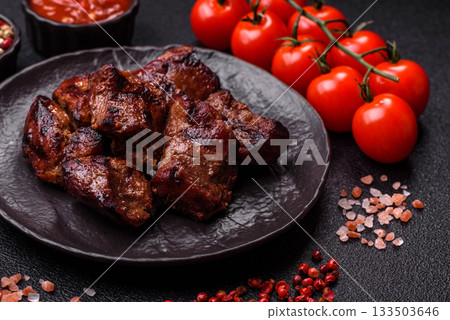 Beef, grilled meat in pieces, or kebab with sauce and vegetables. Beef in pieces Beef, grilled meat in pieces, or kebab with sauce and vegetables. Beef in pieces 133503646