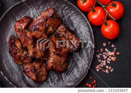 Beef, grilled meat in pieces, or kebab with sauce and vegetables. Beef in pieces Beef, grilled meat in pieces, or kebab with sauce and vegetables. Beef in pieces 133503647