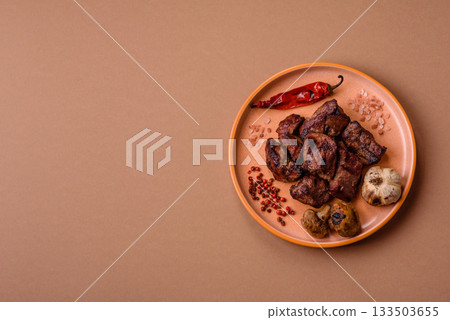 Beef, grilled meat in pieces, or kebab with sauce and vegetables. Beef in pieces Beef, grilled meat in pieces, or kebab with sauce and vegetables. Beef in pieces 133503655