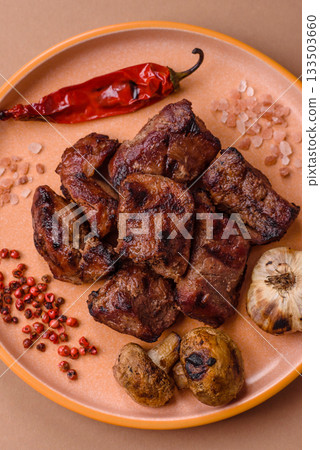 Beef, grilled meat in pieces, or kebab with sauce and vegetables. Beef in pieces Beef, grilled meat in pieces, or kebab with sauce and vegetables. Beef in pieces 133503660