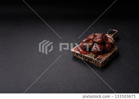 Beef, grilled meat in pieces, or kebab with sauce and vegetables. Beef in pieces Beef, grilled meat in pieces, or kebab with sauce and vegetables. Beef in pieces 133503675