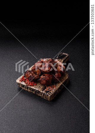 Beef, grilled meat in pieces, or kebab with sauce and vegetables. Beef in pieces Beef, grilled meat in pieces, or kebab with sauce and vegetables. Beef in pieces 133503681