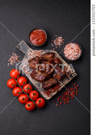 Beef, grilled meat in pieces, or kebab with sauce and vegetables. Beef in pieces Beef, grilled meat in pieces, or kebab with sauce and vegetables. Beef in pieces 133503703