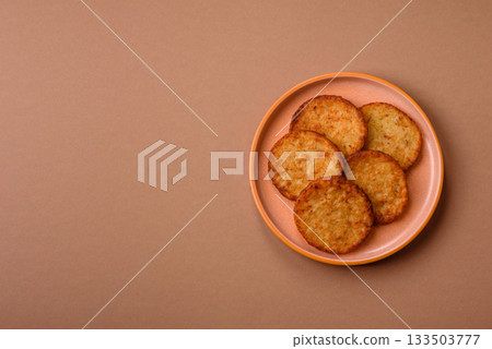 Potato hash browns, a cooked vegetable breakfast food. Potato hash brown 133503777