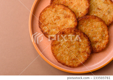 Potato hash browns, a cooked vegetable breakfast food. Potato hash brown 133503781