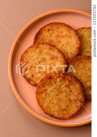 Potato hash browns, a cooked vegetable breakfast food. Potato hash brown Potato hash browns, a cooked vegetable breakfast food. Potato hash brown 133503782