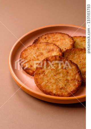 Potato hash browns, a cooked vegetable breakfast food. Potato hash brown 133503783