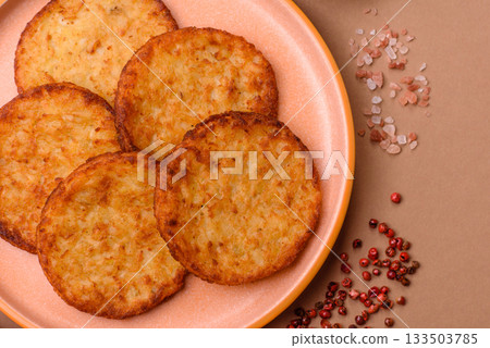Potato hash browns, a cooked vegetable breakfast food. Potato hash brown 133503785