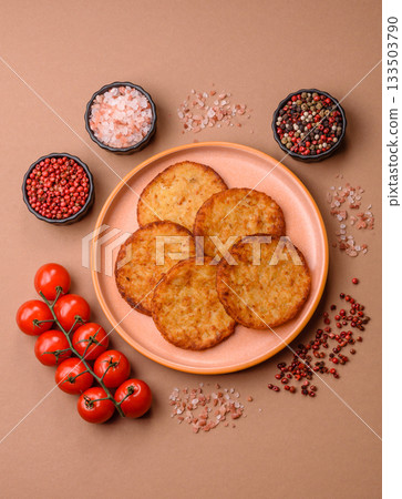 Potato hash browns, a cooked vegetable breakfast food. Potato hash brown Potato hash browns, a cooked vegetable breakfast food. Potato hash brown 133503790