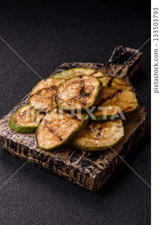 Grilled green zucchini slices, vegetarian food. Green barbecue zucchini 133503793