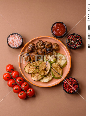 Grilled green zucchini slices, vegetarian food. Green barbecue zucchini Grilled green zucchini slices, vegetarian food. Green barbecue zucchini 133503805