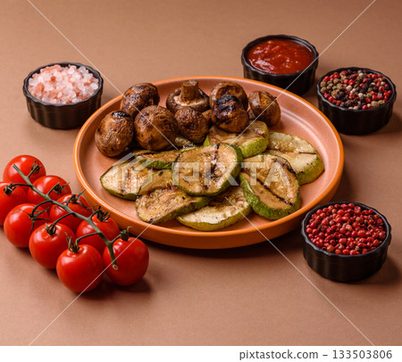 Grilled green zucchini slices, vegetarian food. Green barbecue zucchini Grilled green zucchini slices, vegetarian food. Green barbecue zucchini 133503806