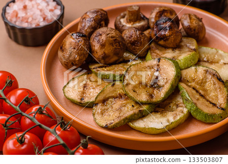 Grilled green zucchini slices, vegetarian food. Green barbecue zucchini Grilled green zucchini slices, vegetarian food. Green barbecue zucchini 133503807