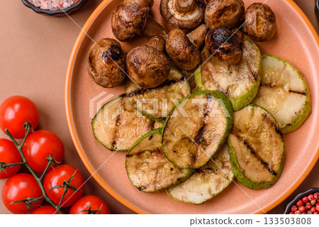 Grilled green zucchini slices, vegetarian food. Green barbecue zucchini Grilled green zucchini slices, vegetarian food. Green barbecue zucchini 133503808