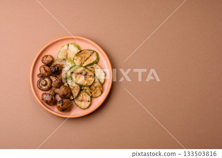 Grilled green zucchini slices, vegetarian food. Green barbecue zucchini Grilled green zucchini slices, vegetarian food. Green barbecue zucchini 133503816