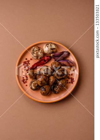 Grilled mushroom pieces, a vegetarian healthy meal with sauce. Barbecue mushroom halves 133503821