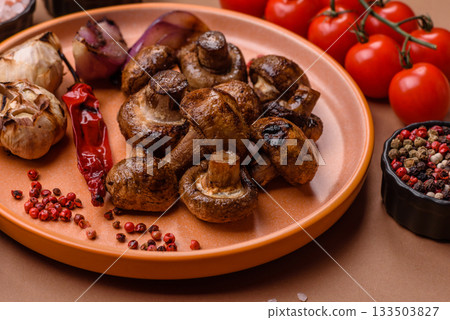 Grilled mushroom pieces, a vegetarian healthy meal with sauce. Barbecue mushroom halves Grilled mushroom pieces, a vegetarian healthy meal with sauce. Barbecue mushroom halves 133503827