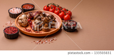 Grilled mushroom pieces, a vegetarian healthy meal with sauce. Barbecue mushroom halves Grilled mushroom pieces, a vegetarian healthy meal with sauce. Barbecue mushroom halves 133503831