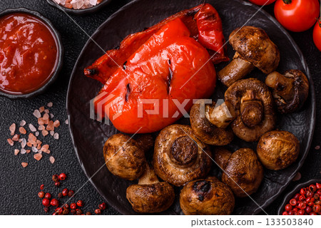 Grilled mushroom pieces, a vegetarian healthy meal with sauce. Barbecue mushroom halves 133503840