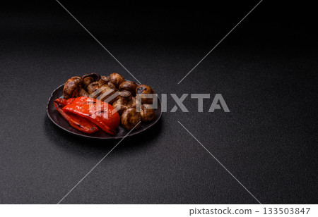 Grilled mushroom pieces, a vegetarian healthy meal with sauce. Barbecue mushroom halves 133503847