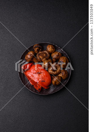 Grilled mushroom pieces, a vegetarian healthy meal with sauce. Barbecue mushroom halves Grilled mushroom pieces, a vegetarian healthy meal with sauce. Barbecue mushroom halves 133503849