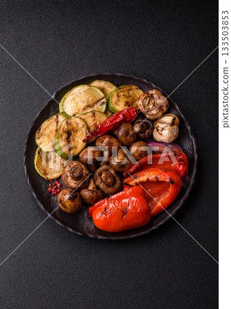 Grilled vegetables, bell peppers, mushrooms, and zucchini, a vegetarian meal. Grilled vegetables 133503853