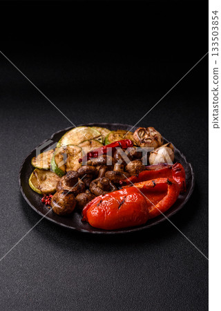 Grilled vegetables, bell peppers, mushrooms, and zucchini, a vegetarian meal. Grilled vegetables 133503854